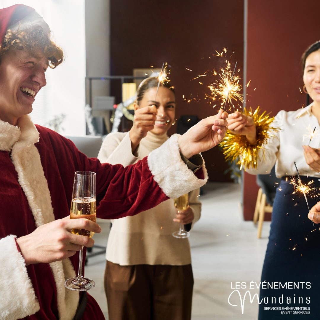Party des Fêtes au bureau avec cierges magiques et coupes de champagne